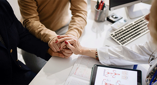 provider reviewing medical information with couple
